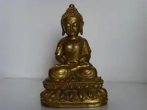 这样的铜释迦摩尼,有修补,值钱吗
